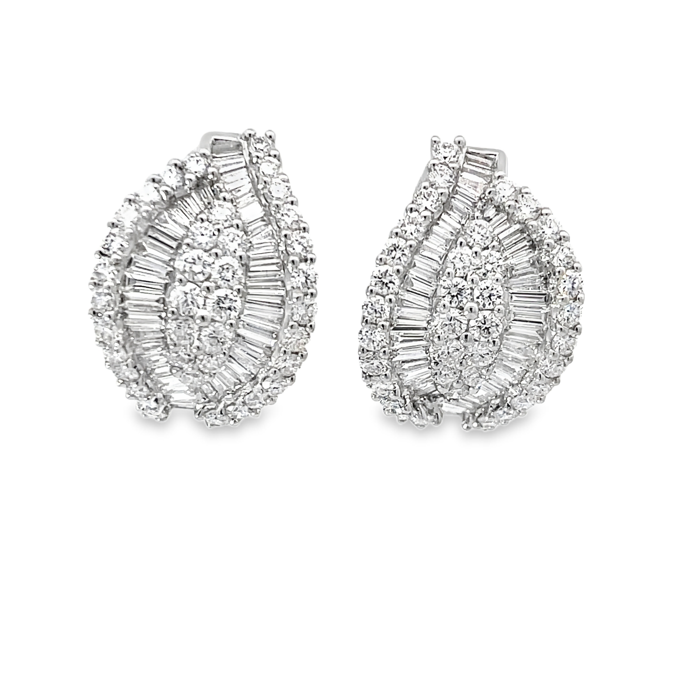 These exquisite teardrop earrings are a true testament to elegance and sophistication. Adorned with intricate patterns of sparkling diamonds, they catch the light beautifully, adding a touch of glamour to any outfit. 18k WG 8.29 Grams 154D-4.25 Carat