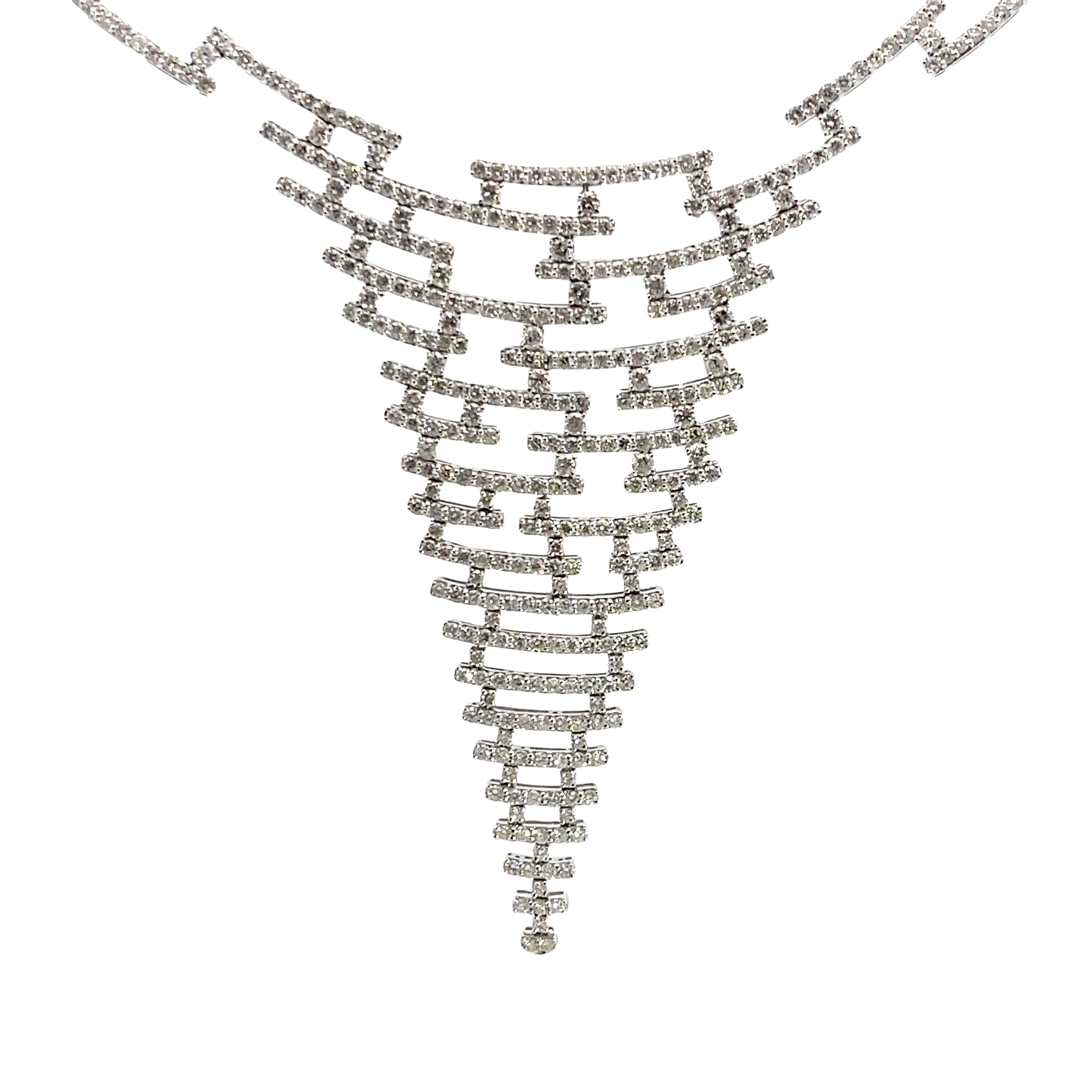 This stunning white gold necklace features a unique geometric design that includes 610 diamonds which cascades elegantly down the neckline. Perfect for adding a touch of sophistication to any outfit, this piece is sure to turn heads at any event. 18k WG 48.65 Grams 610R-22.55 Carat